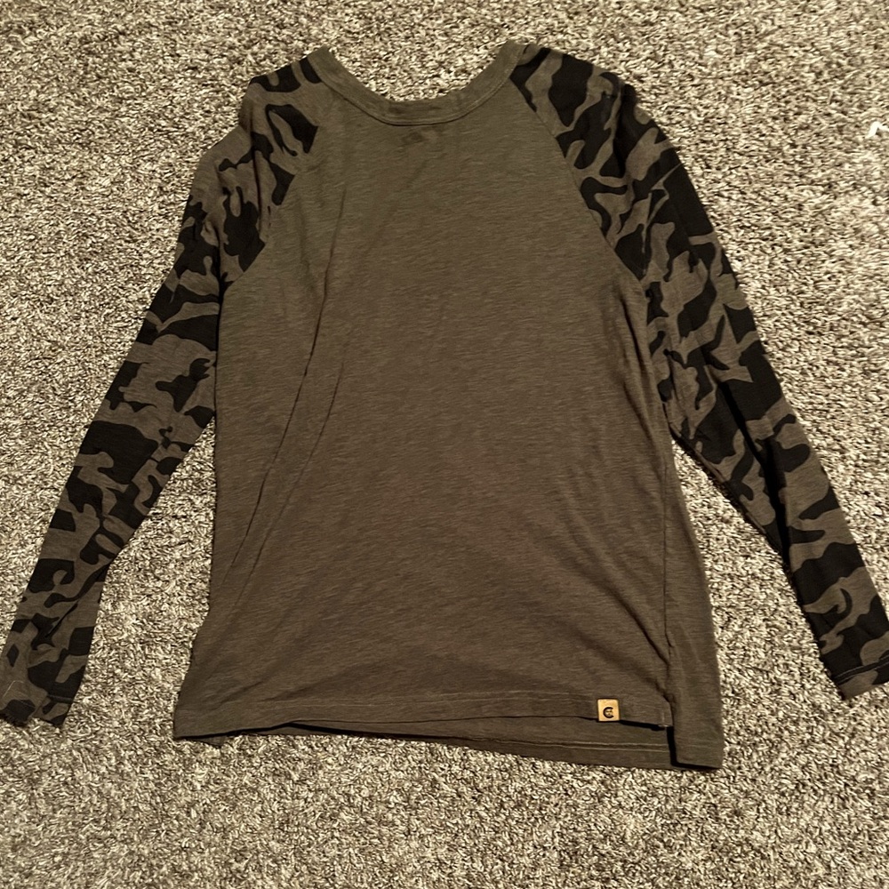 Green and camouflage long sleeve going out shirt.